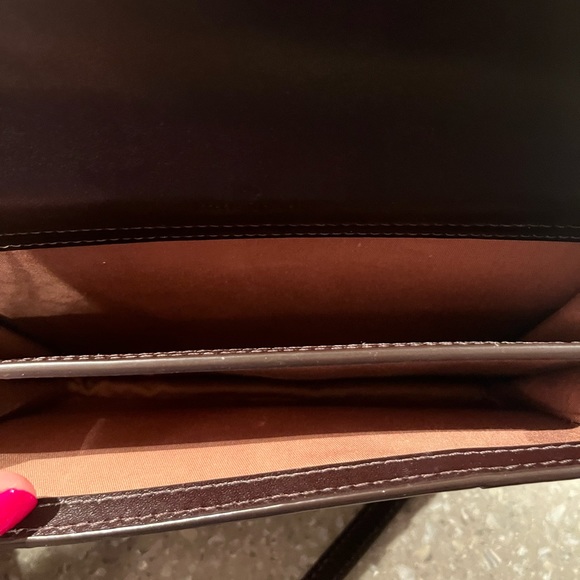 Rich chocolate brown mini bag has an adjustable shoulder strap and gold letters - Picture 7 of 12